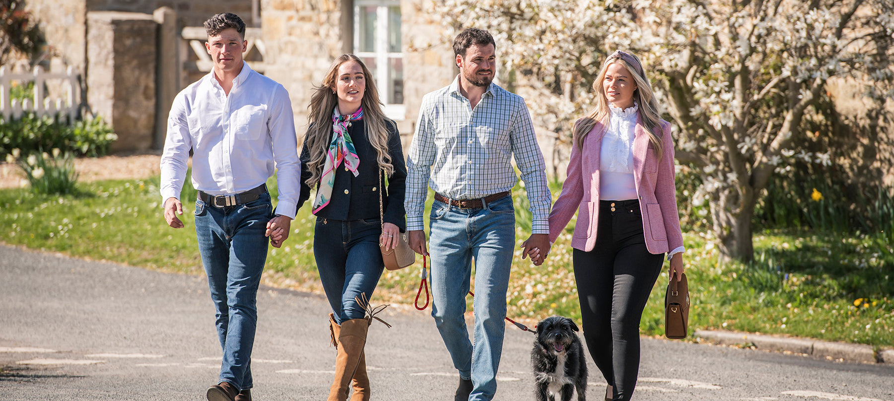Four people and a dog in new season clothing