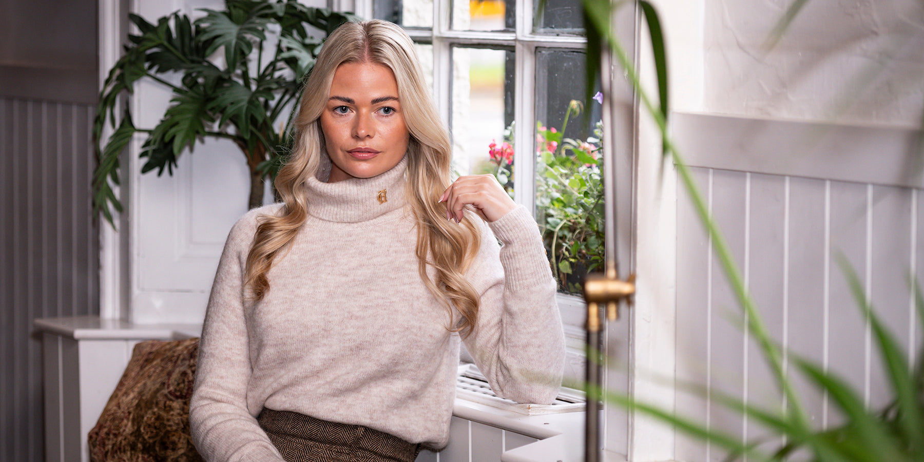 Woman wearing Holland Cooper jumper & skirt