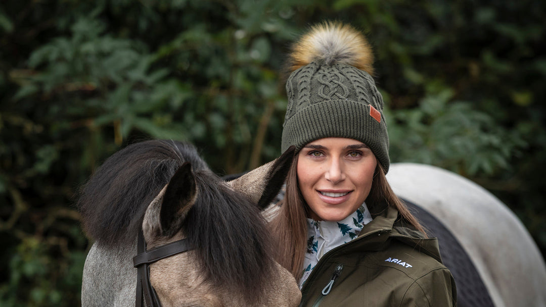 Woman in an Ariat bobble hat