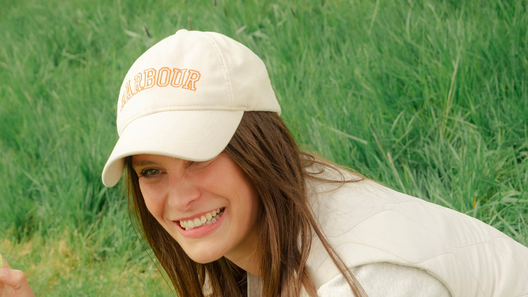Woman wearing a Barbour cap