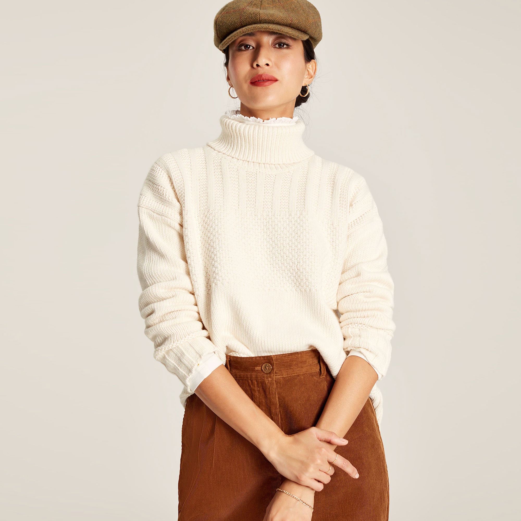 Cream roll neck clearance top