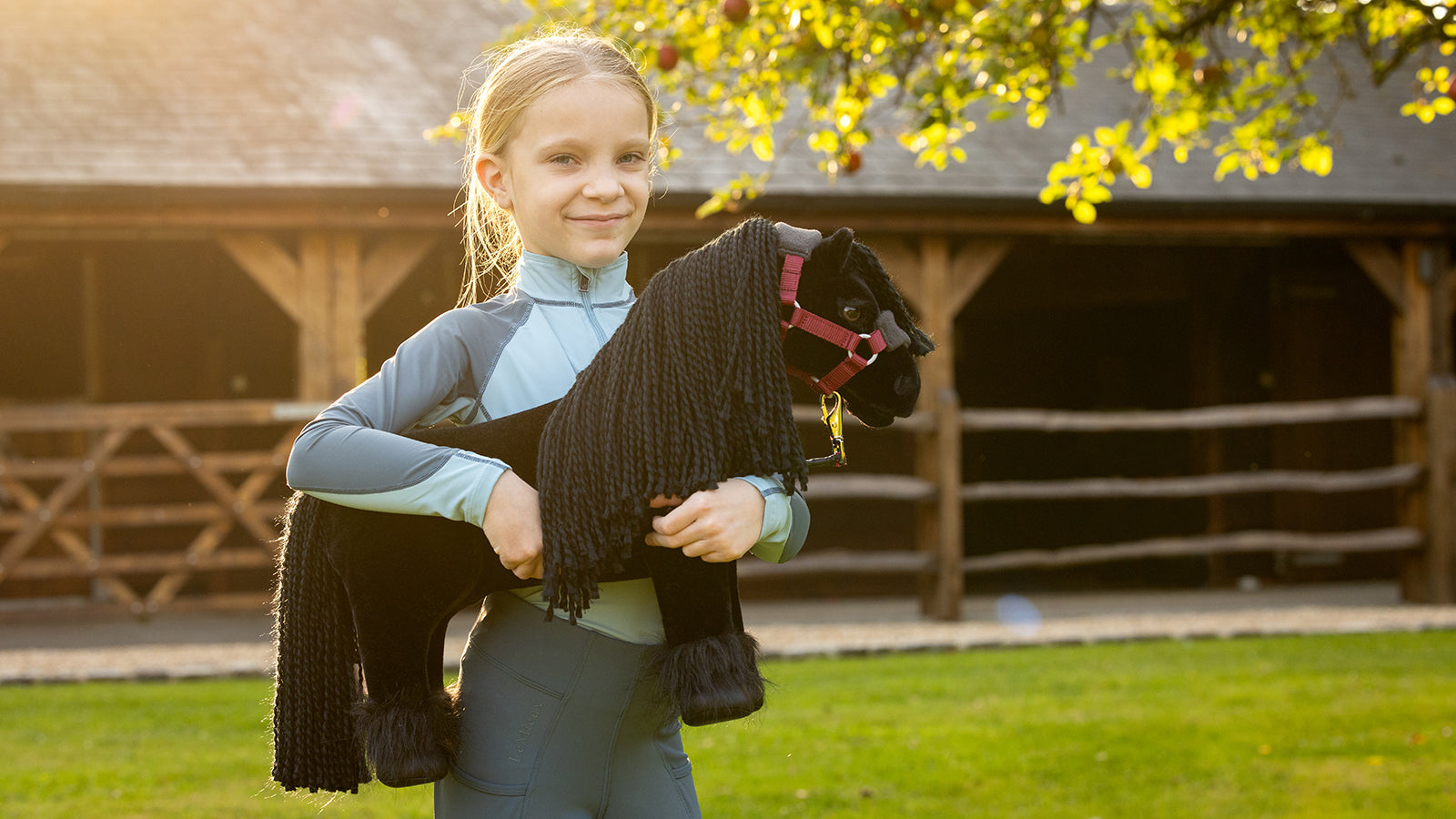 Girl holding a LeMieux pony