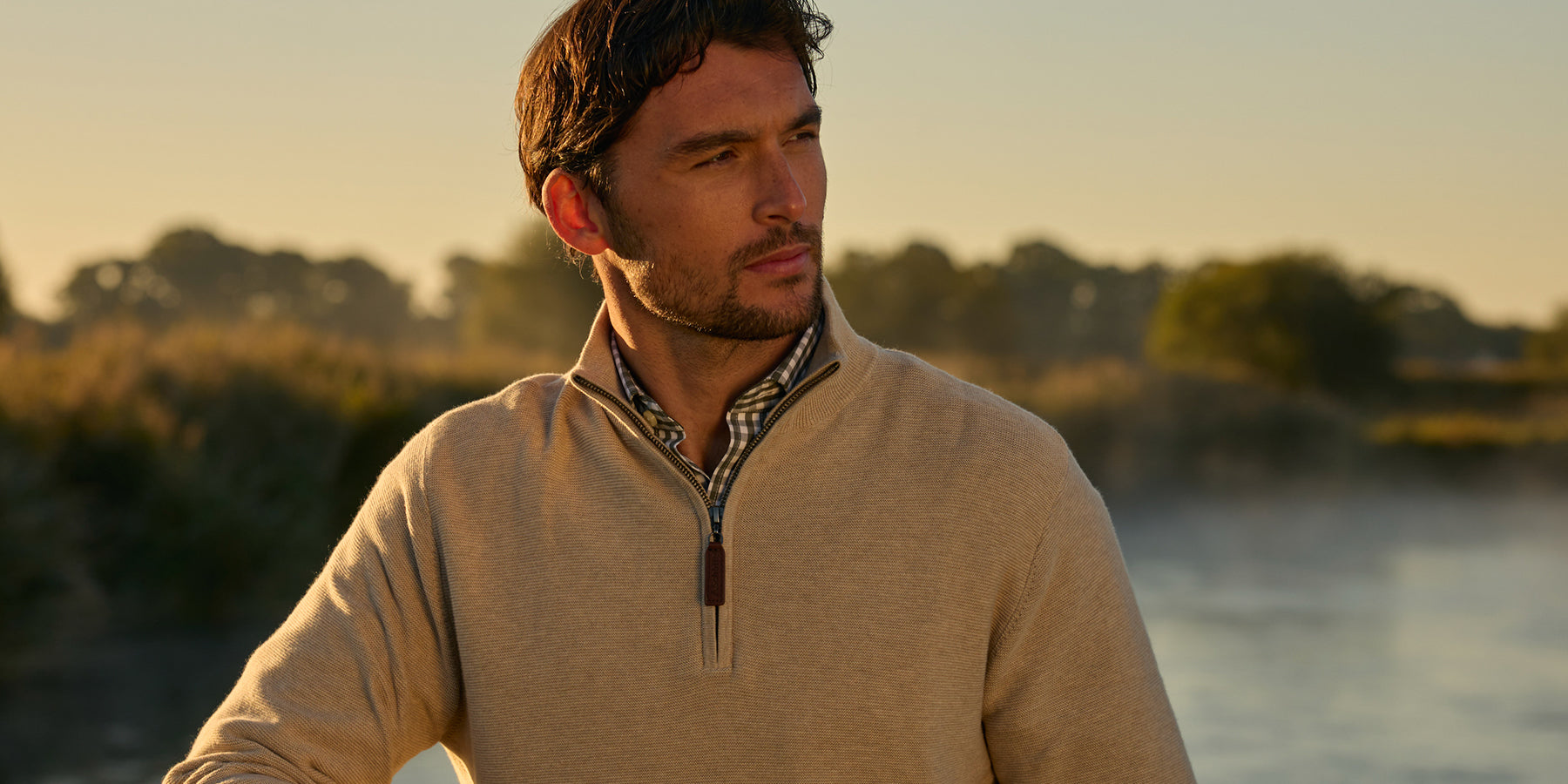 Man stood by a lake wearing Schoffel clothing