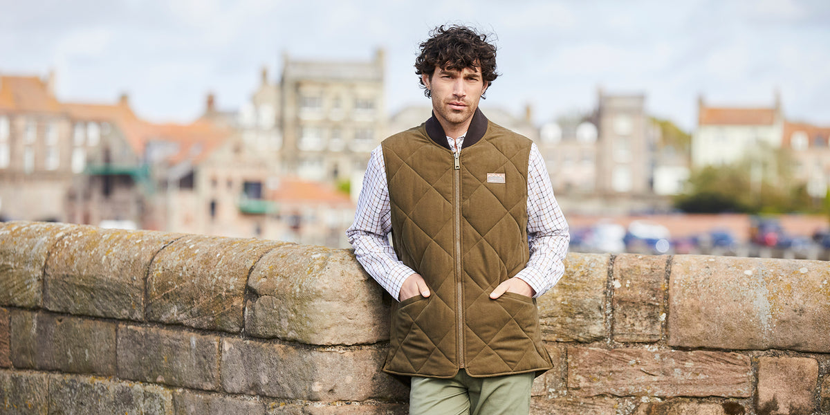 Man stood on a bridge wearing new Ridgeline clothing