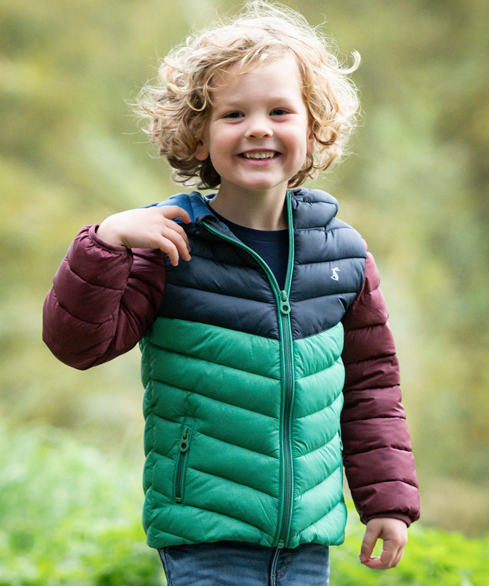 Boy wearing Joules coat