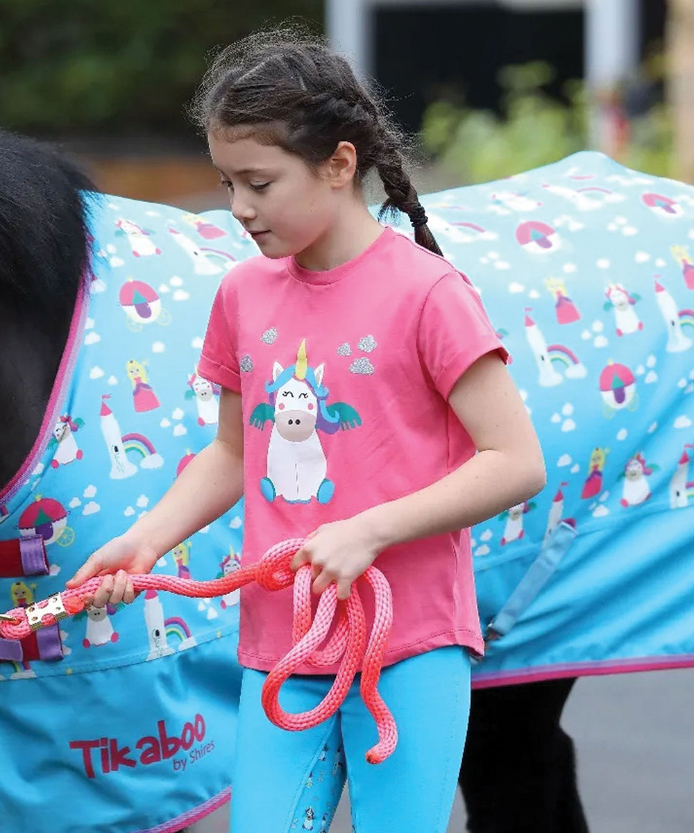 Girl in pink t-shirt with pony