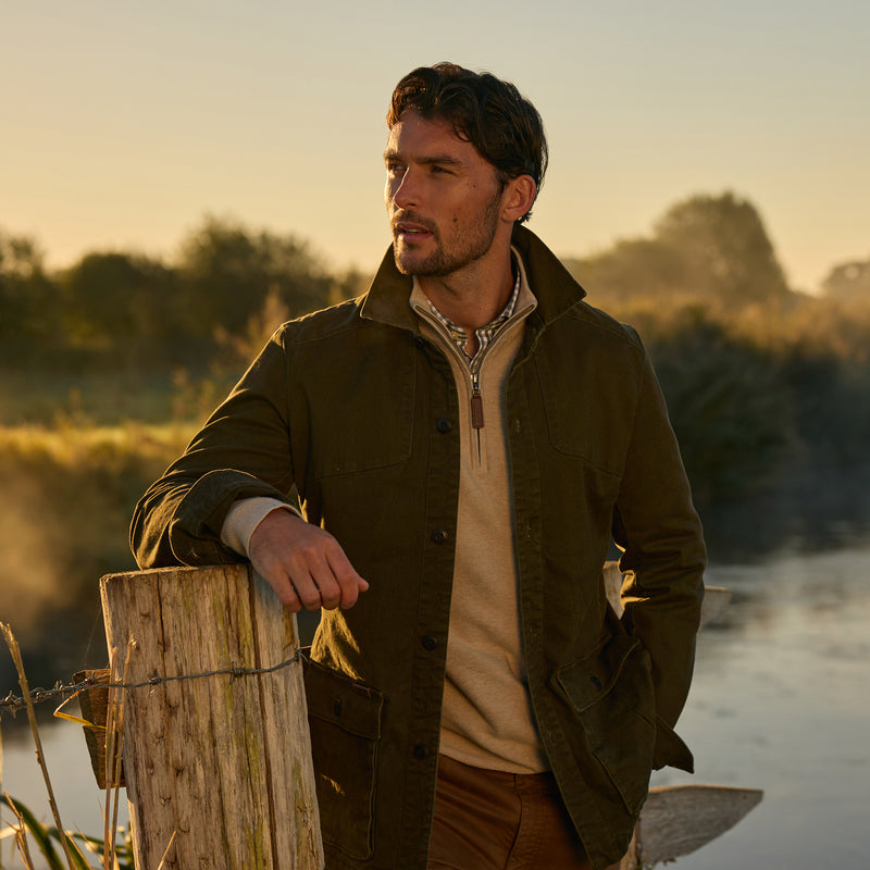 Man stood by a lake in Schoffel clothing