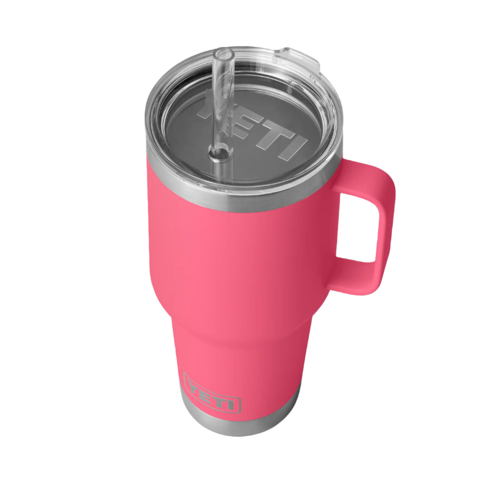 Pink YETI tumbler with handle on a white background