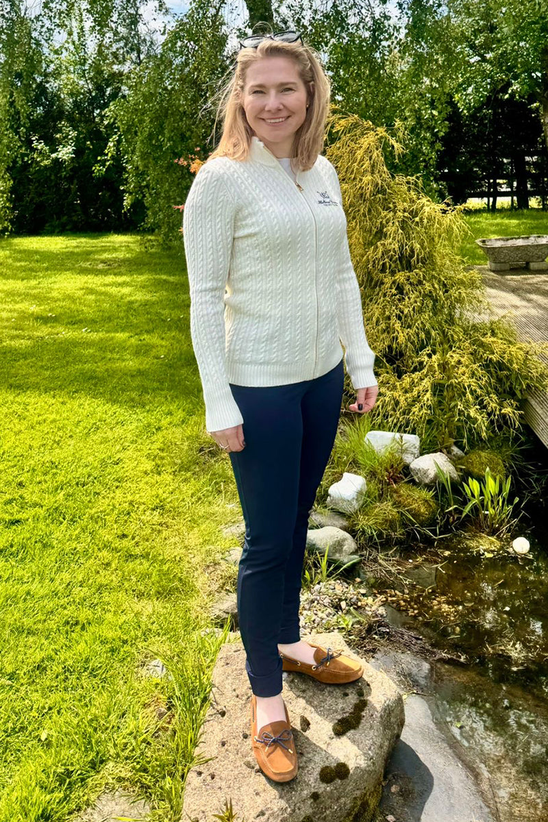 Bobby Hayler-Wright in a garden wearing Millbry Hill clothing
