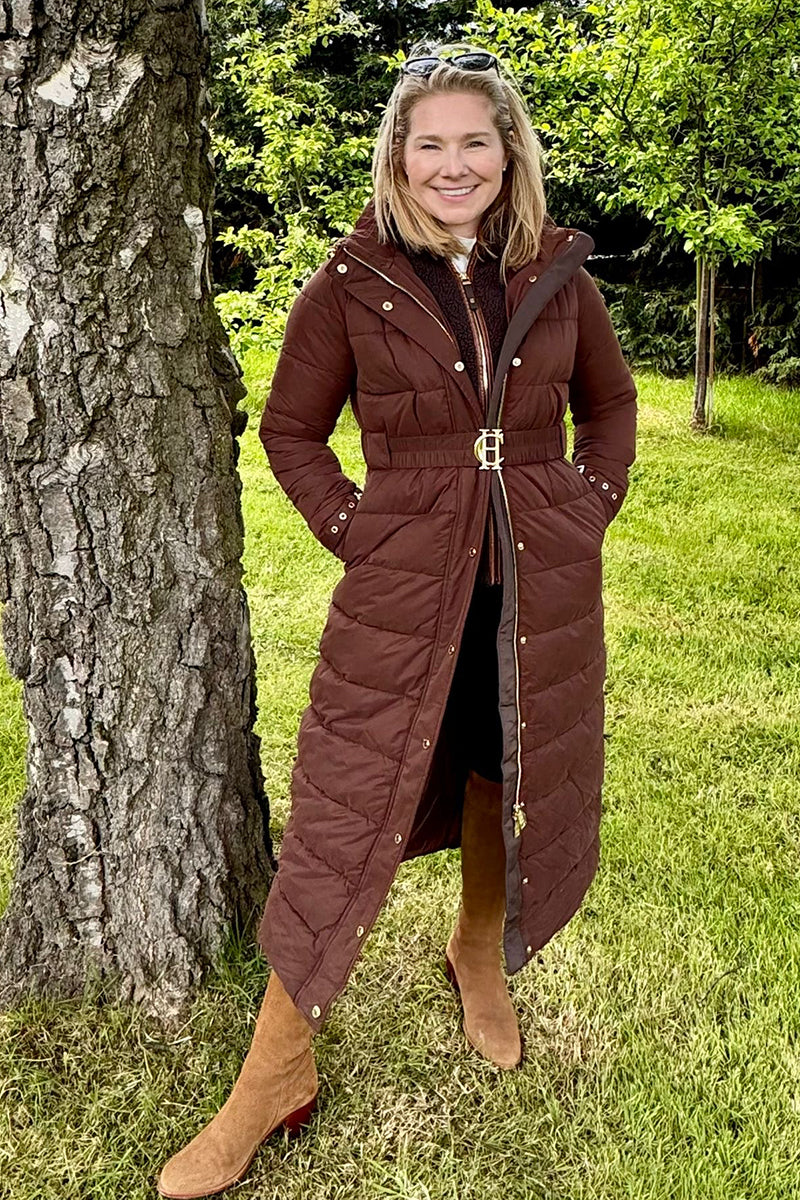 Bobby Hayler-Wright in a garden wearing Holland Cooper clothing and Fairfax & Favor boots