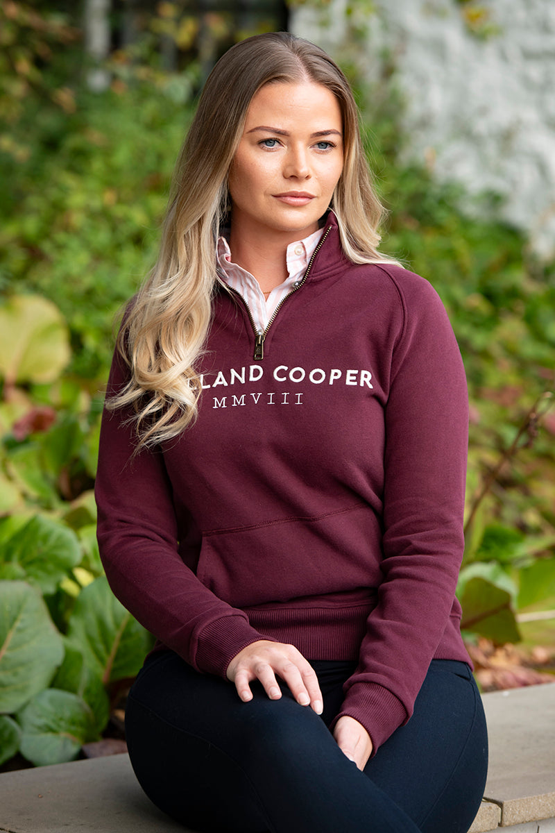 Woman wearing Holland Cooper sweatshirt and jeans