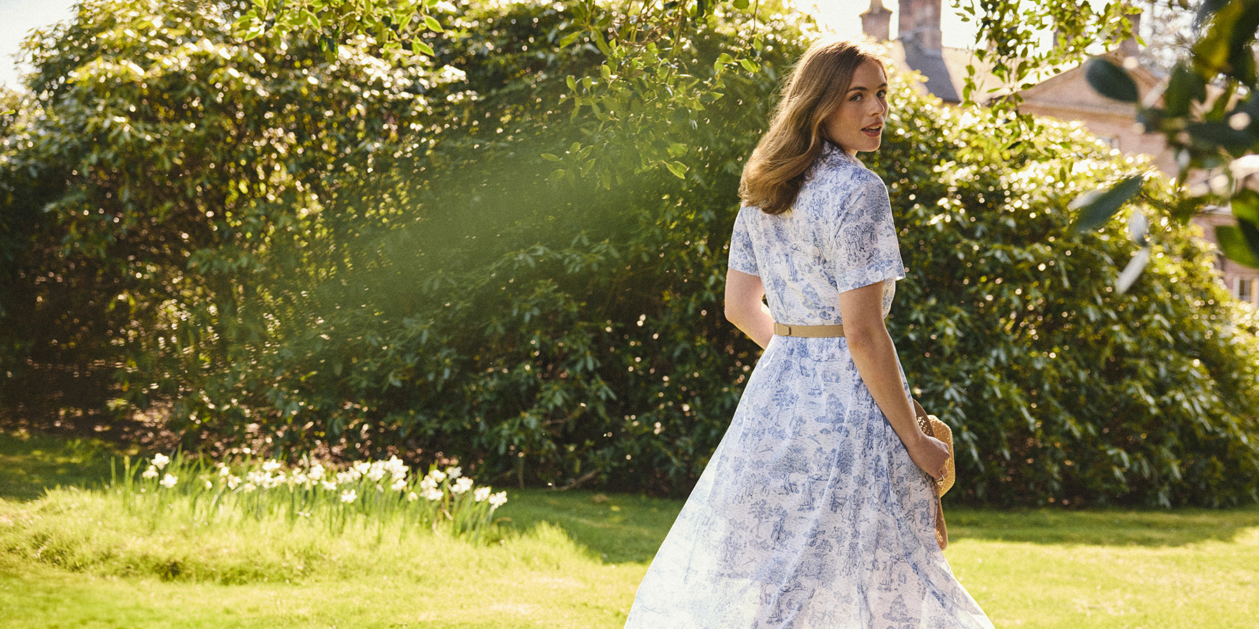 Woman in a garden wearing a Barbour dress