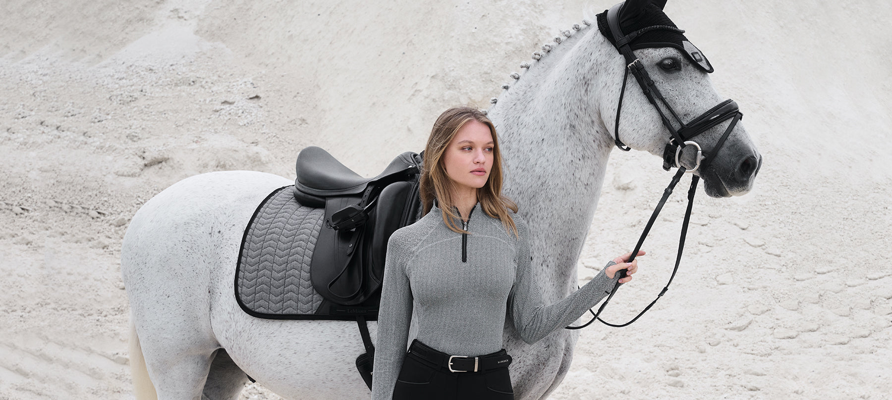 Woman and horse wearing LeMieux Aspen Clothing