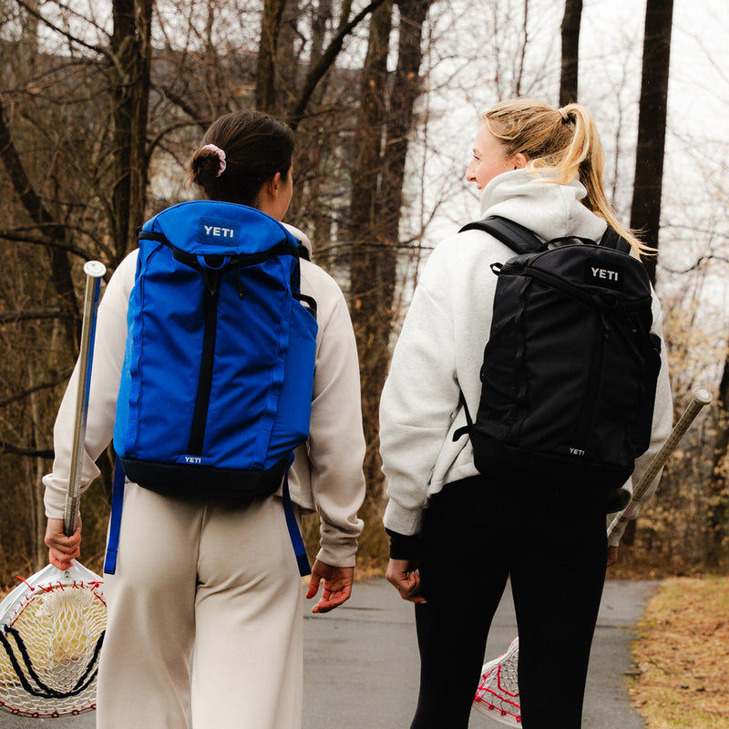Two women wearing new Yeti Palo backpacks