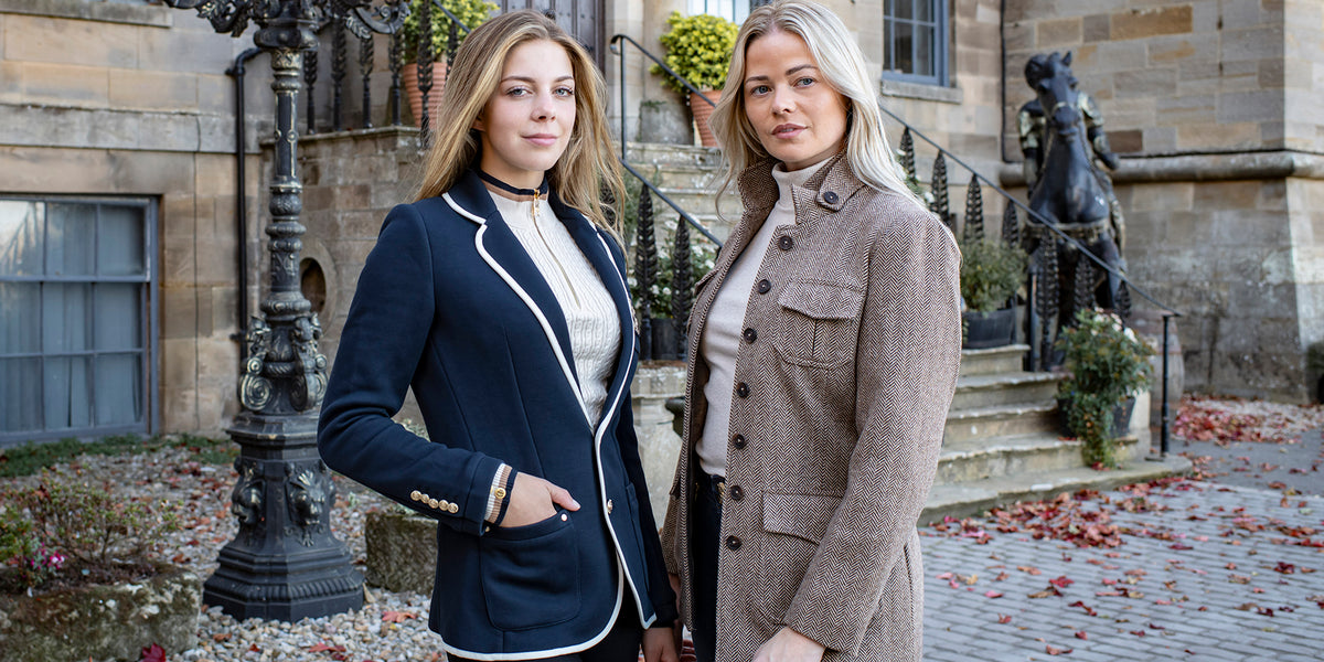 Two women at a castle wearing new Autumnal clothing
