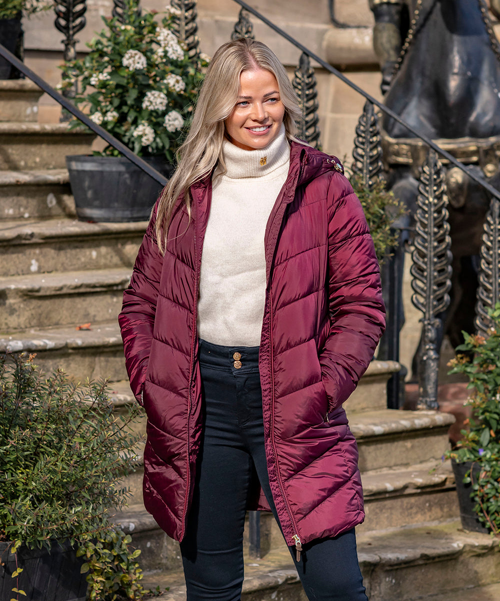 Woman in front of some steps in new autmnal clothing