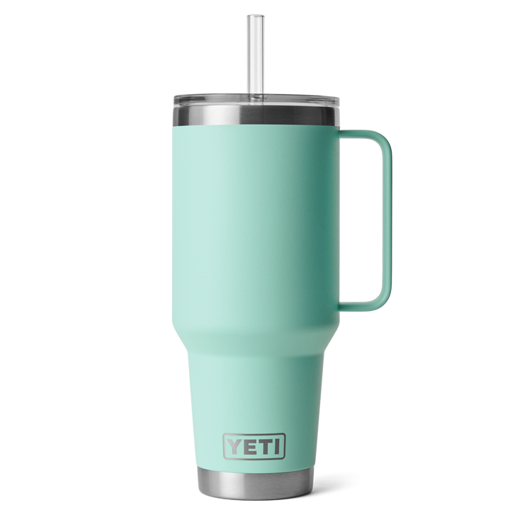 Mint green YETI mug with handle and straw on a white background