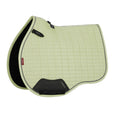 Light green saddle pad with black accents on a white background