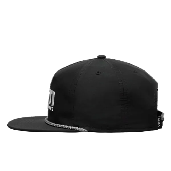 A black flat-brim snapback cap with a silver chain detail along the edge of the brim and a white YETI logo on the side, shown against a plain white background.